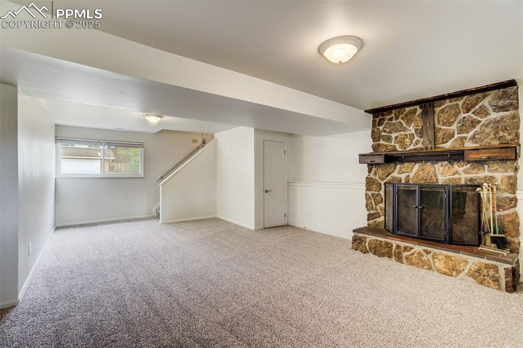 Image 24 of 44: Very spacious family room has room for fun and games, with cozy area by the