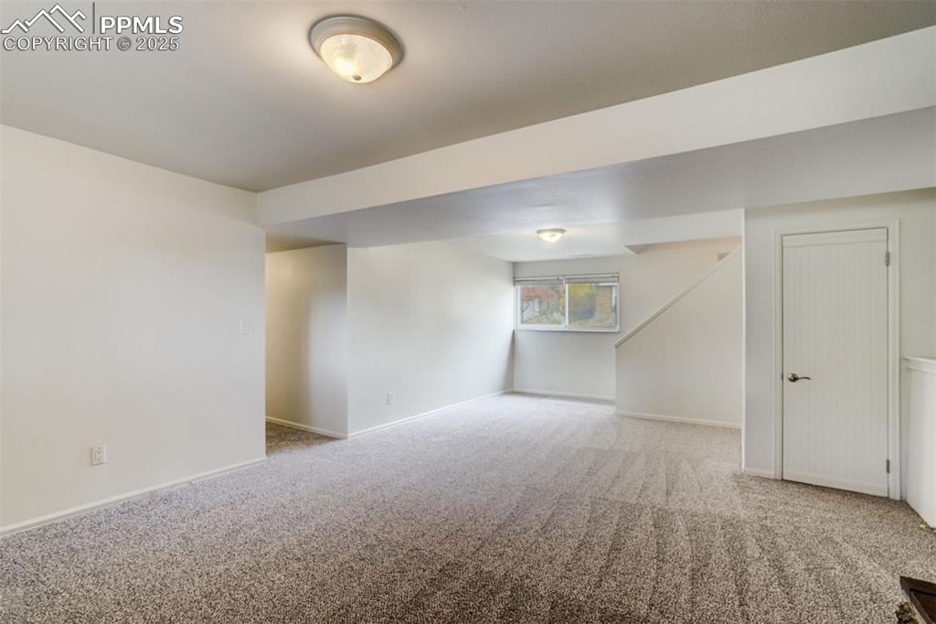 Image 25 of 44: Great amount of light in the family room with large storage closet under th