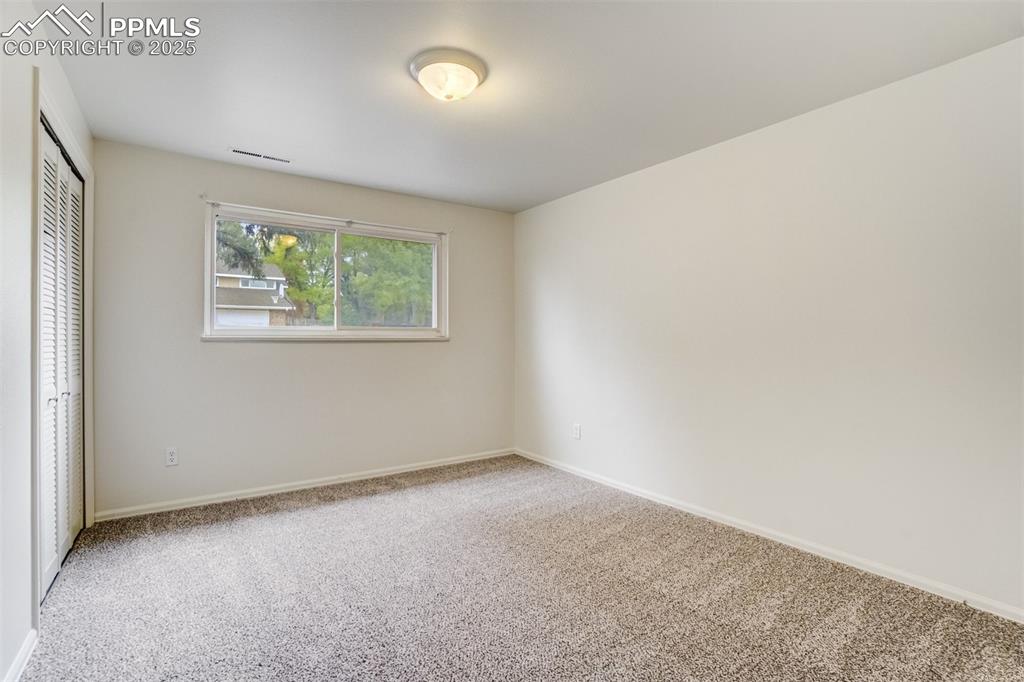 Image 26 of 44: Bedroom 3 in lower level