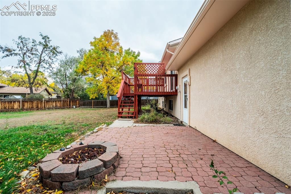 Image 35 of 44: Nice patio with built in fire pit