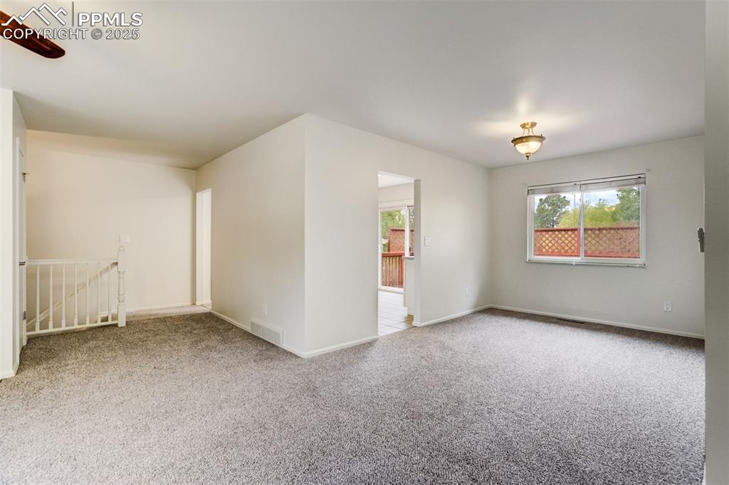 Image 6 of 44: Dining room window has Pikes Peak and mountain views
