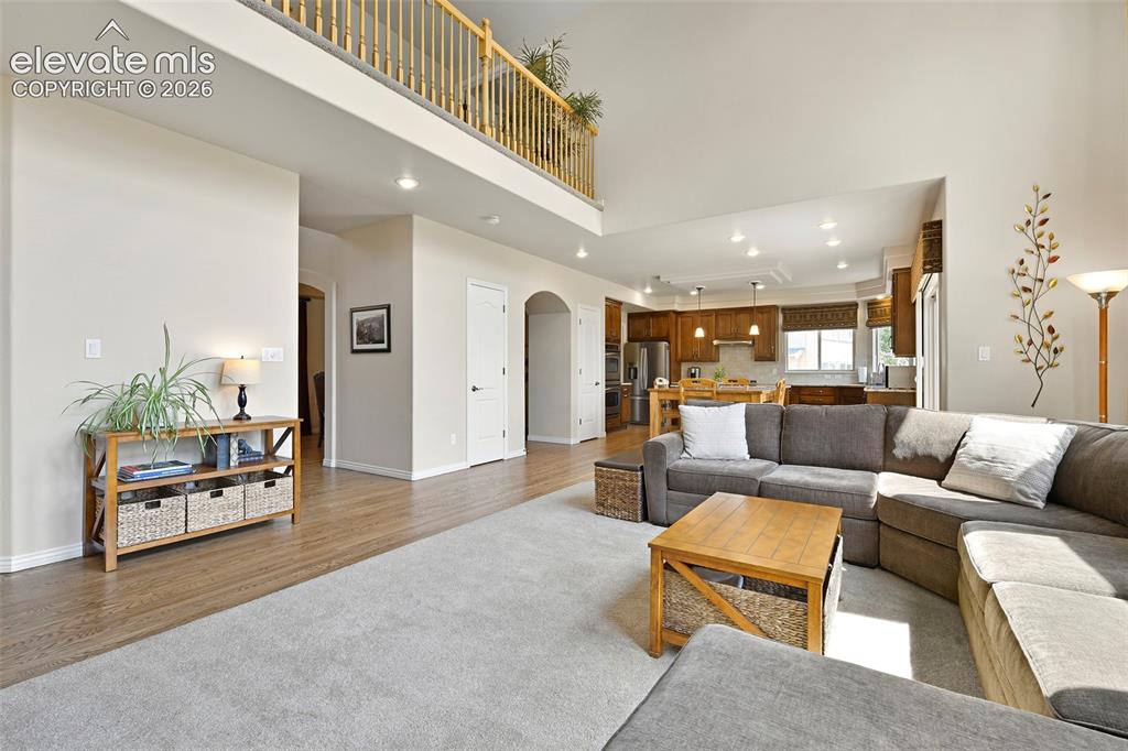 Image 10 of 46: Open to the upstairs balcony and...