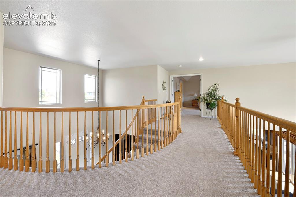 Image 19 of 46: Gorgeous upper corridor with views!