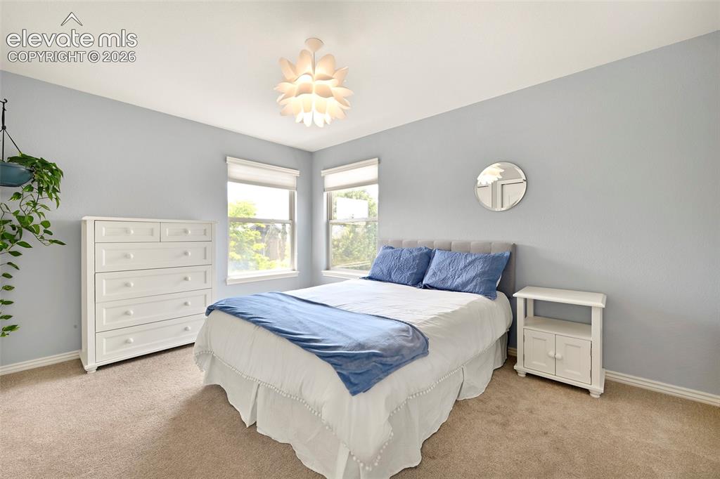 Image 29 of 46: Secondary upper bedroom with some views