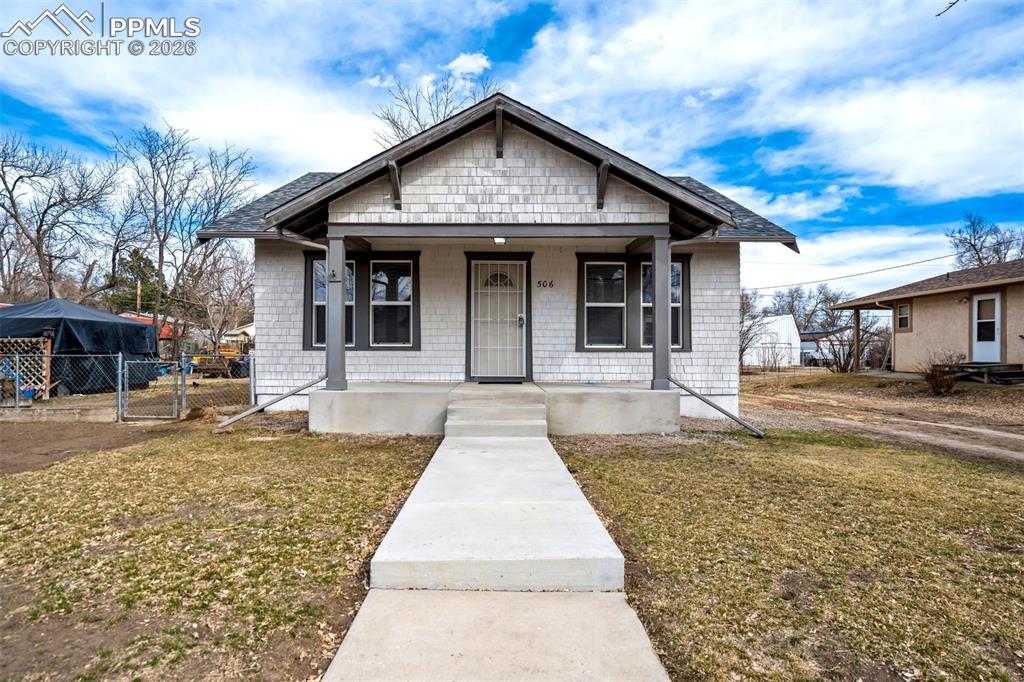 Image 1 of 38: Attractive street presence with mature surroundings and a spacious lot. Lon