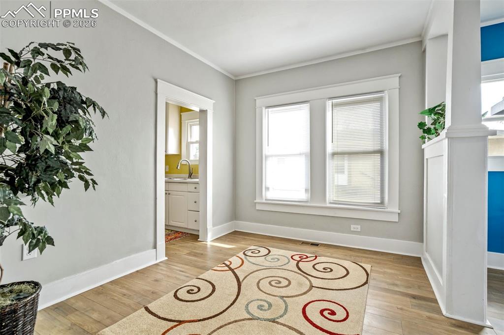 Image 18 of 38: Versatile dining or flex area featuring abundant natural light and clean, m