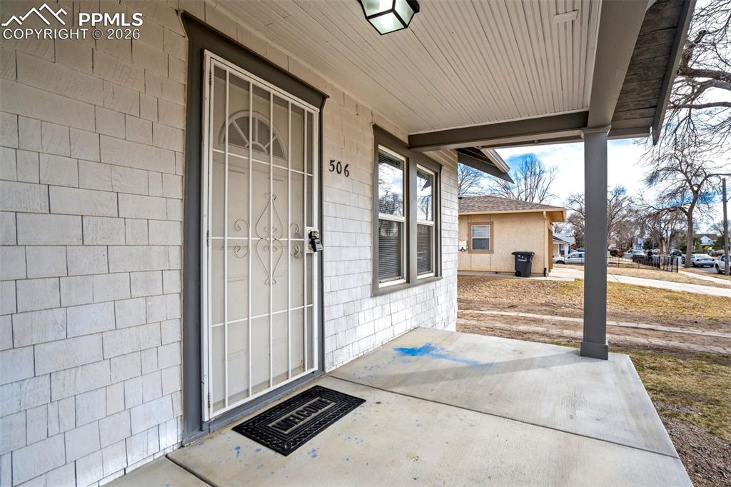 Image 3 of 38: Charming covered front porch provides a great spot to relax and enjoy the n