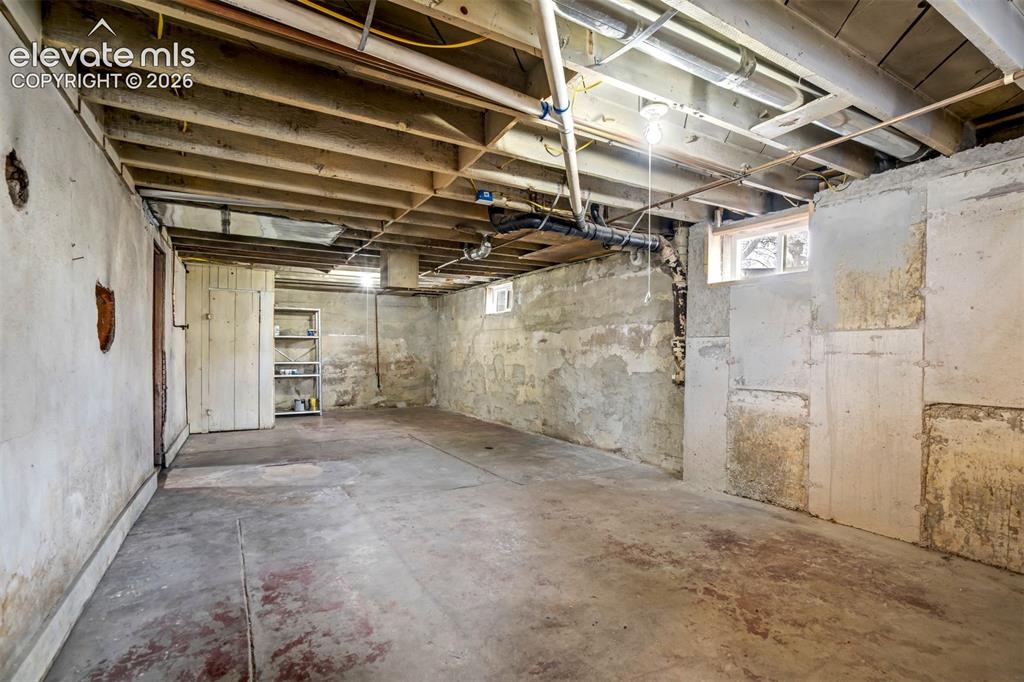 Image 32 of 36: Multiple basement spaces provide flexibility for workshop, storage, or hobb