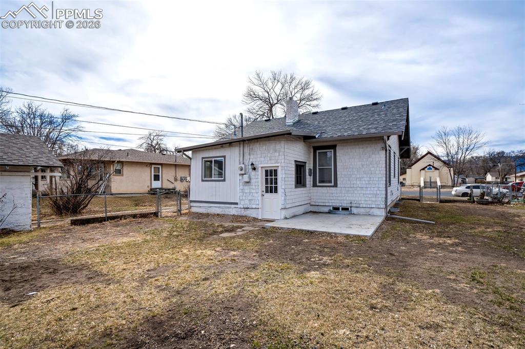 Image 33 of 38: Spacious backyard with plenty of room for outdoor activities, pets, or futu