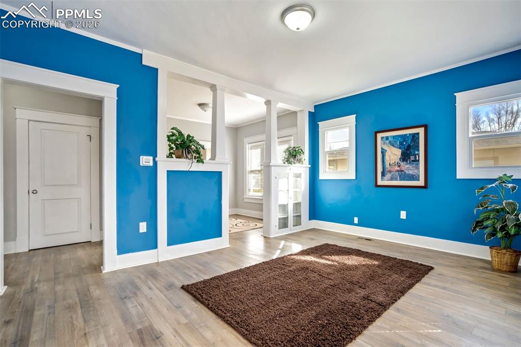 Image 6 of 38: Welcoming entry opens directly into a bright living space with great natura
