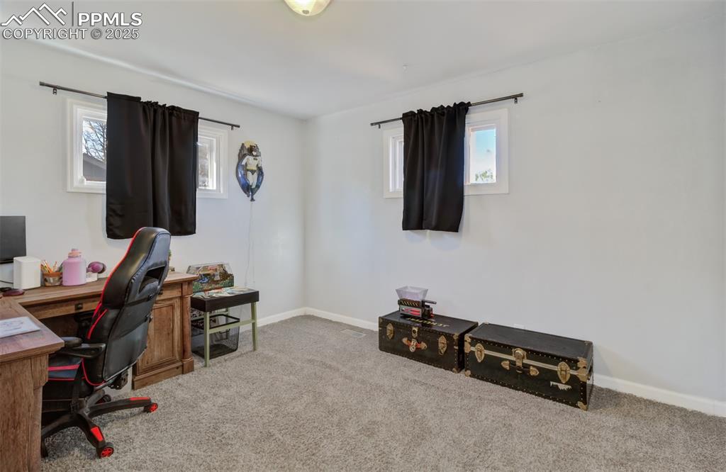 Image 13 of 29: Carpeted office featuring plenty of natural light and baseboards