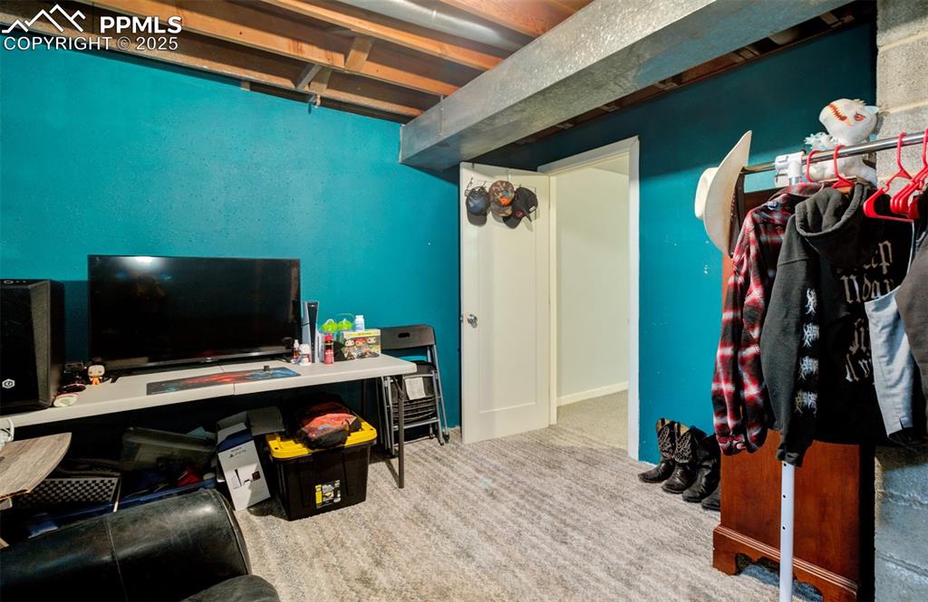 Image 21 of 29: Office area with carpet floors