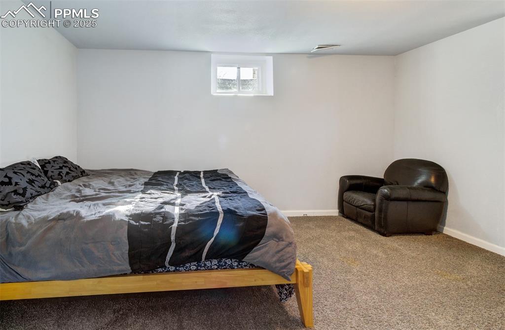 Image 25 of 29: Bedroom featuring baseboards, visible vents, and carpet floors