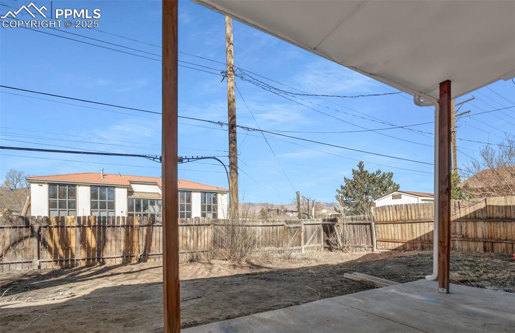 Image 27 of 29: View of yard featuring a fenced backyard and a patio