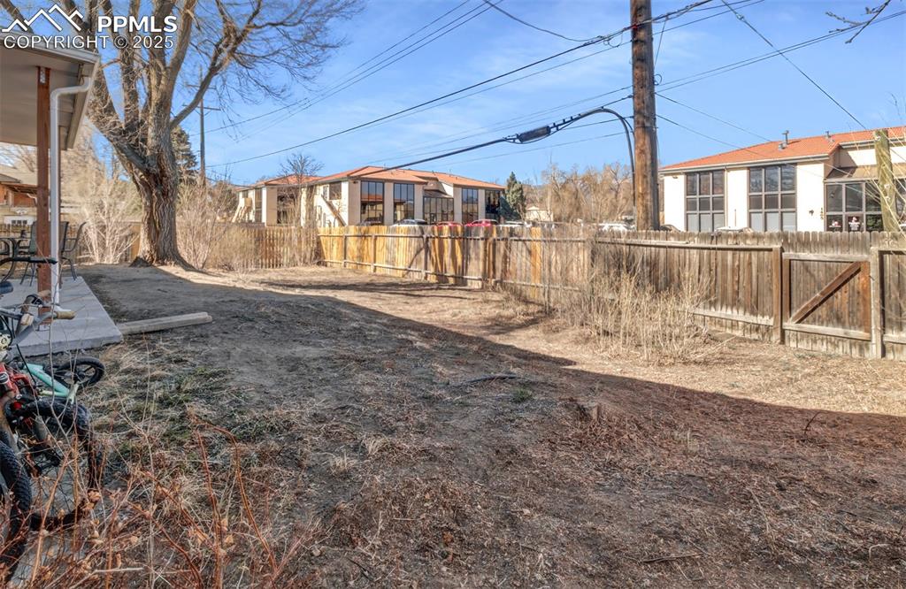 Image 28 of 29: View of yard featuring a fenced backyard