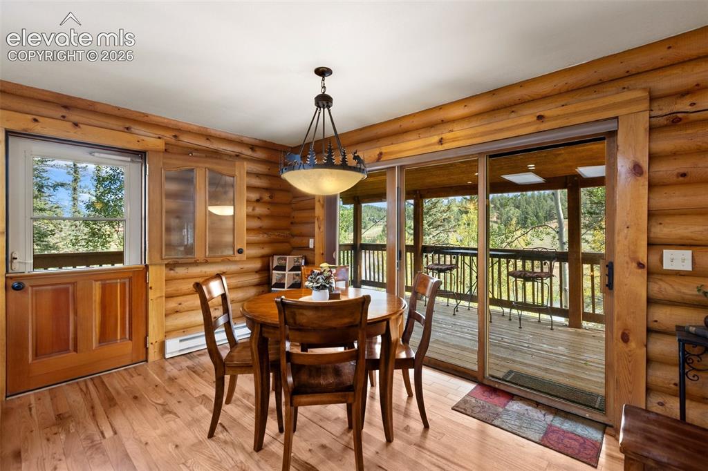 Image 11 of 37: Dining room and walk out to porch