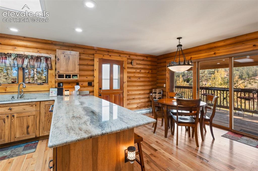 Image 12 of 37: Kitchen and dining area.
