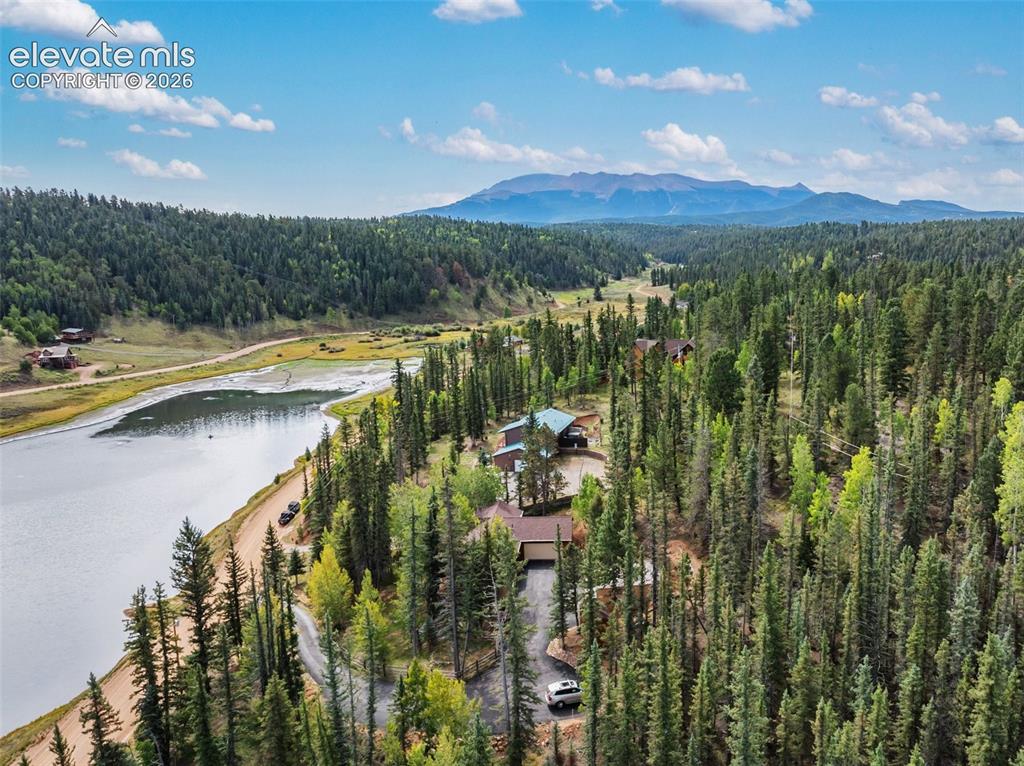 Image 30 of 37: Ariel of property, lake and Pikes Peak!