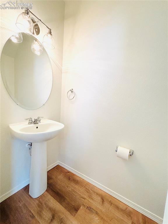 Image 12 of 24: MAIN LEVEL POWDER ROOM