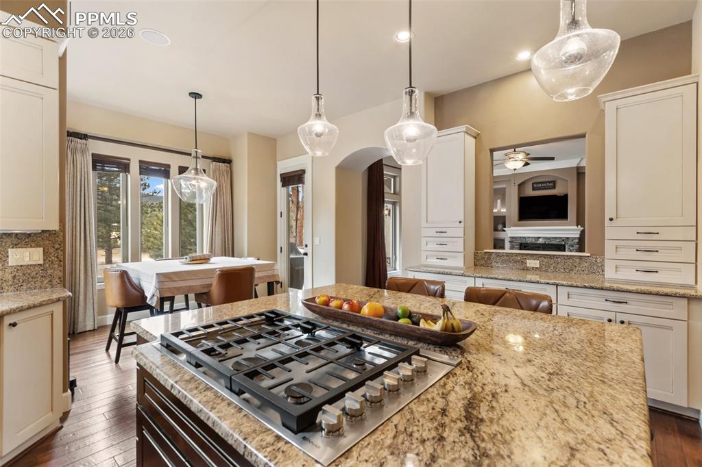 Image 11 of 44: Kitchen with JennAir gas stove top