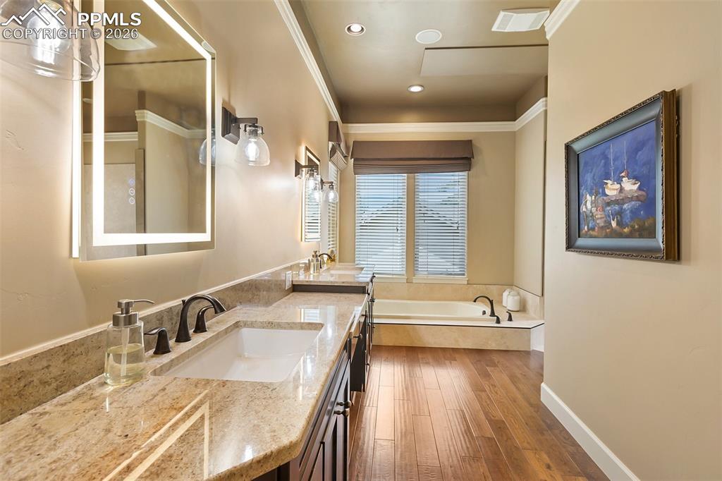 Image 16 of 44: Primary suite bathroom