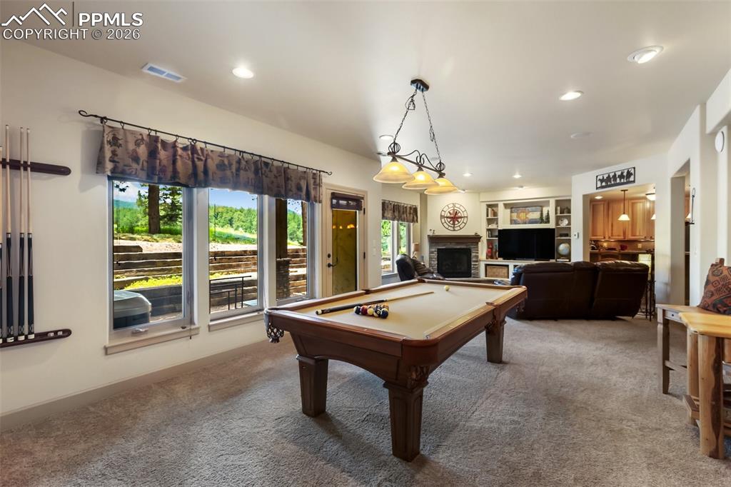 Image 31 of 44: Basement Family and Pool Room