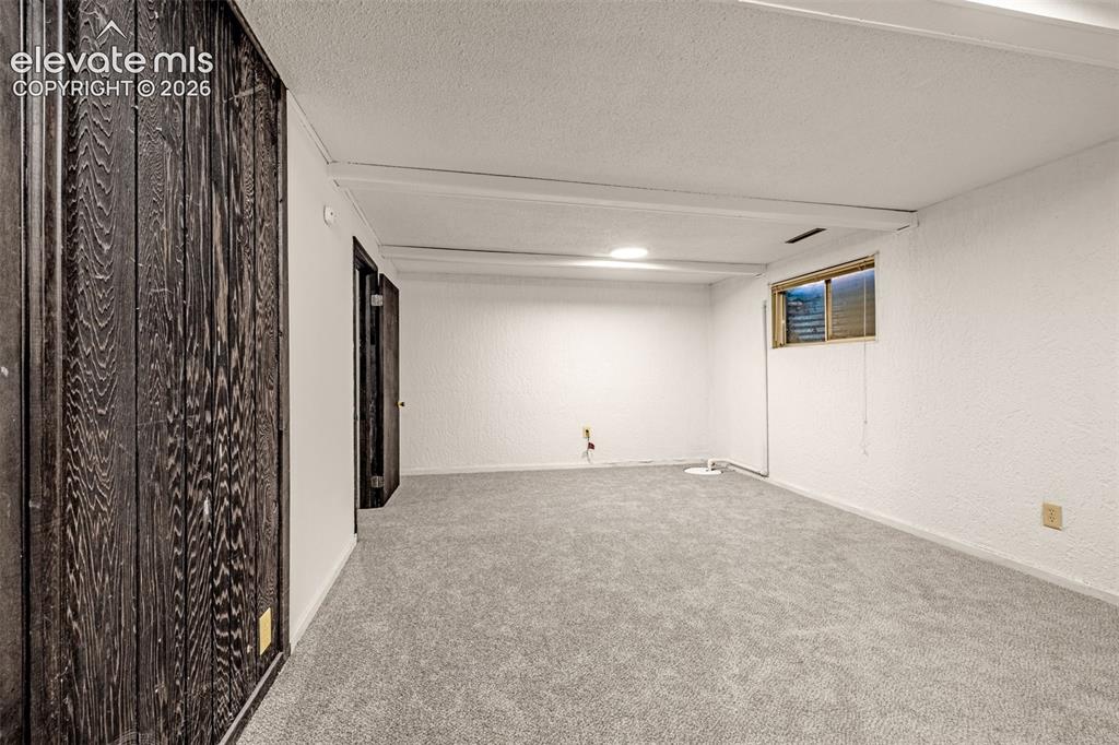 Image 29 of 45: Family room in basement