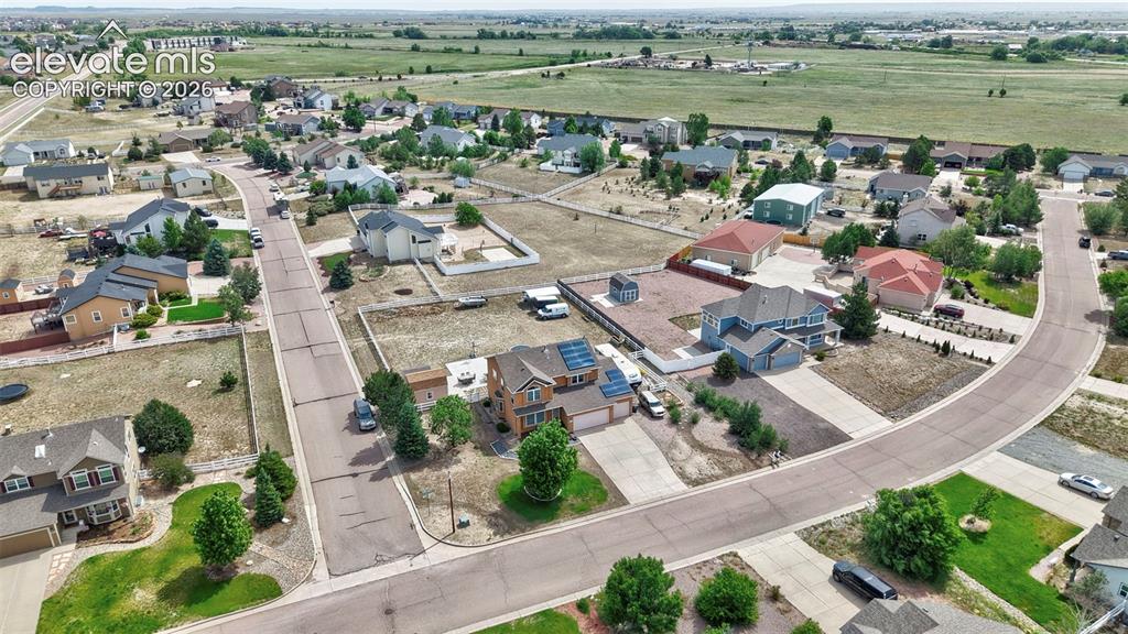 Image 31 of 37: Aerial perspective showcasing a residential neighborhood with varied home s