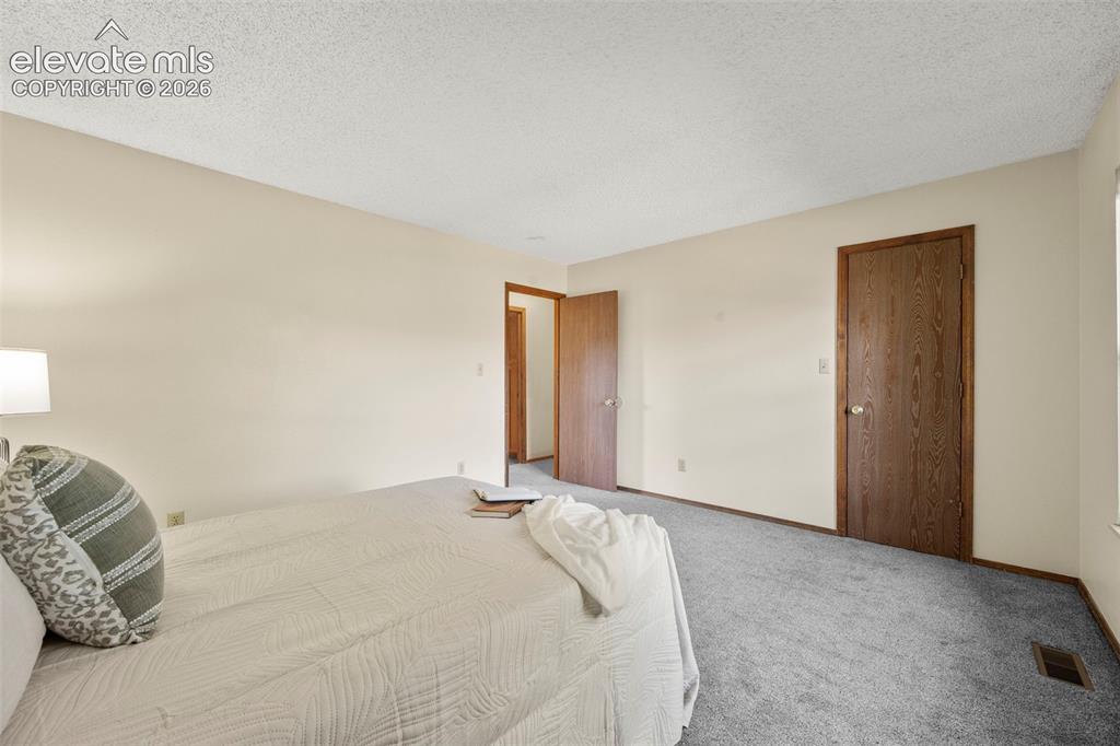 Image 15 of 27: Upper level primary bedroom