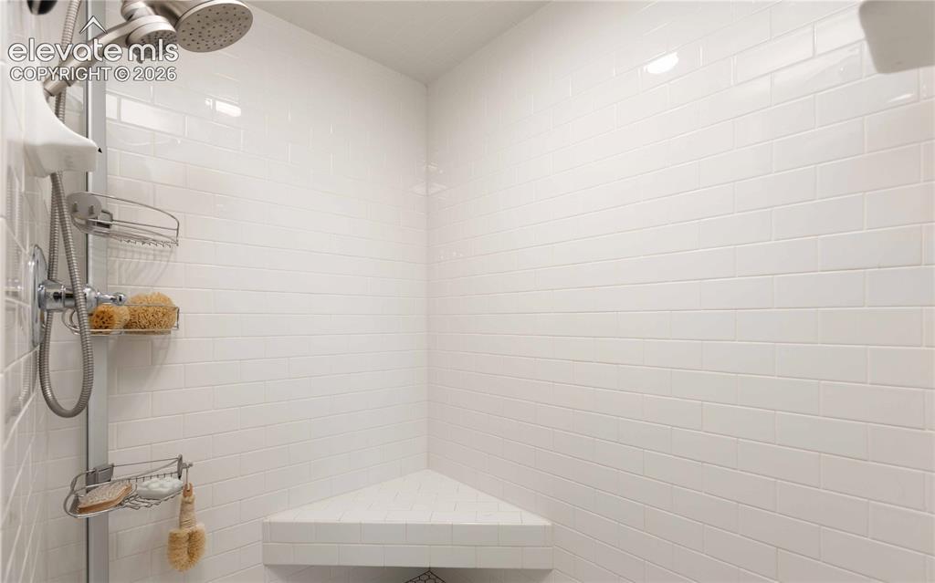 Image 16 of 37: Large tiled steam shower
