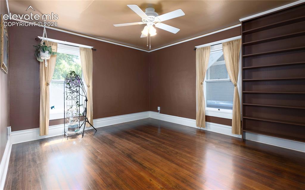 Image 19 of 37: 4th bedroom looks out over back and side yard