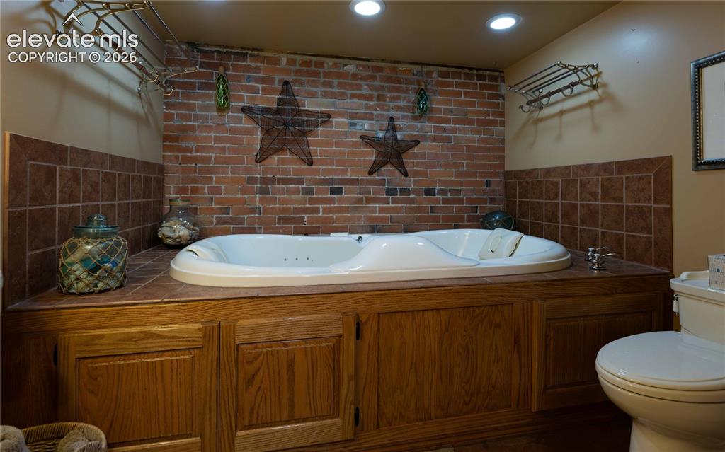 Image 26 of 37: 2-person jetted tub for spa-like wellness retreat