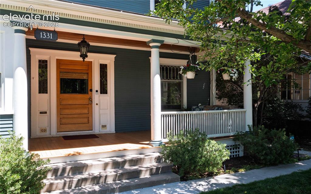 Image 3 of 37: Lovely shaded front porch