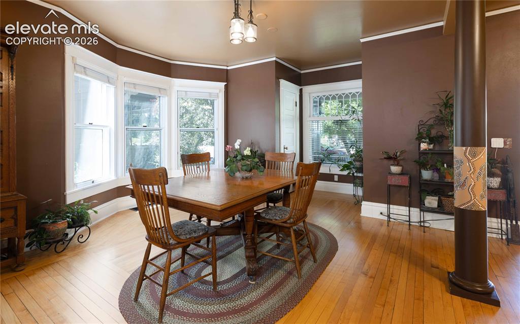 Image 5 of 37: Wide open dining space with huge windows