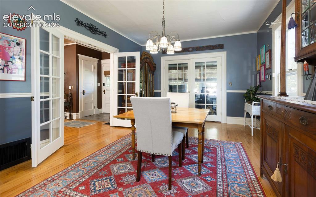 Image 7 of 37: Large eat-in kitchen area with french doors to office