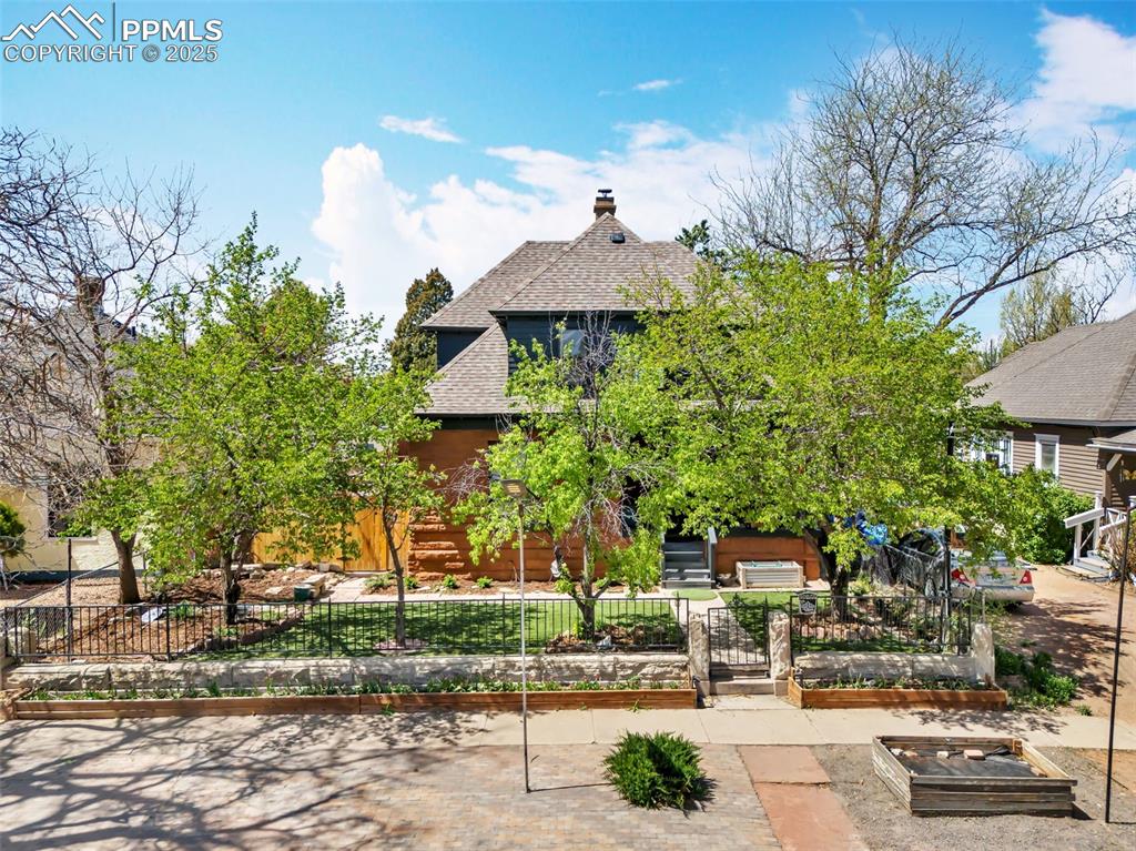 Image 2 of 50: Nestled behind beautiful mature trees, making it feel so private!