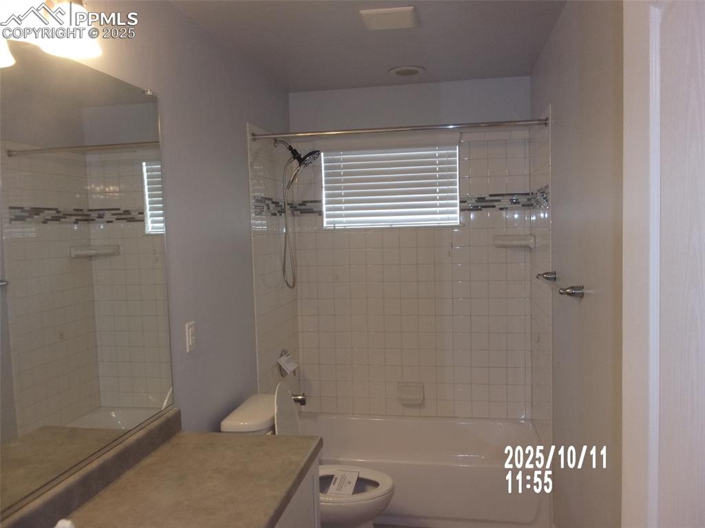 Image 13 of 21: Full bathroom with vanity and tub / shower combination