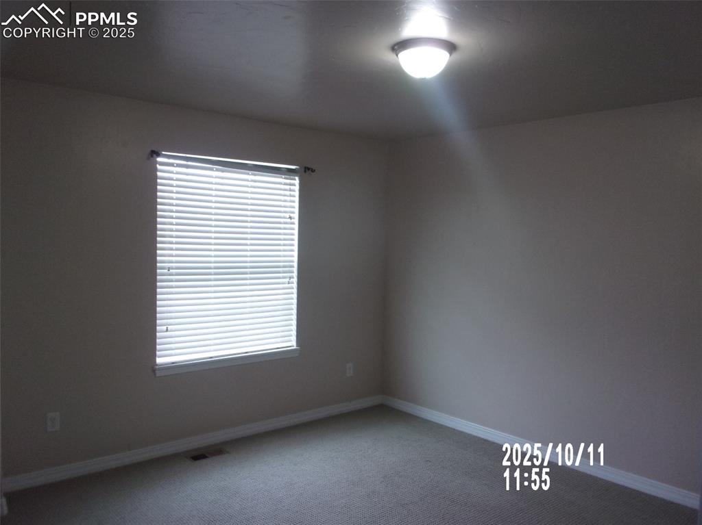 Image 15 of 21: Carpeted empty room featuring baseboards