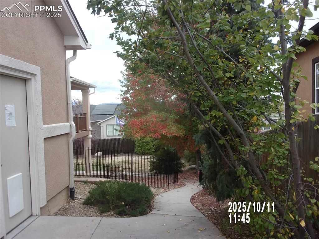 Image 20 of 21: View of property exterior with stucco siding