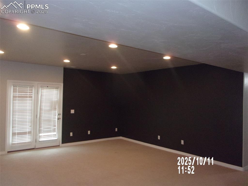 Image 9 of 21: Spare room featuring recessed lighting and light carpet