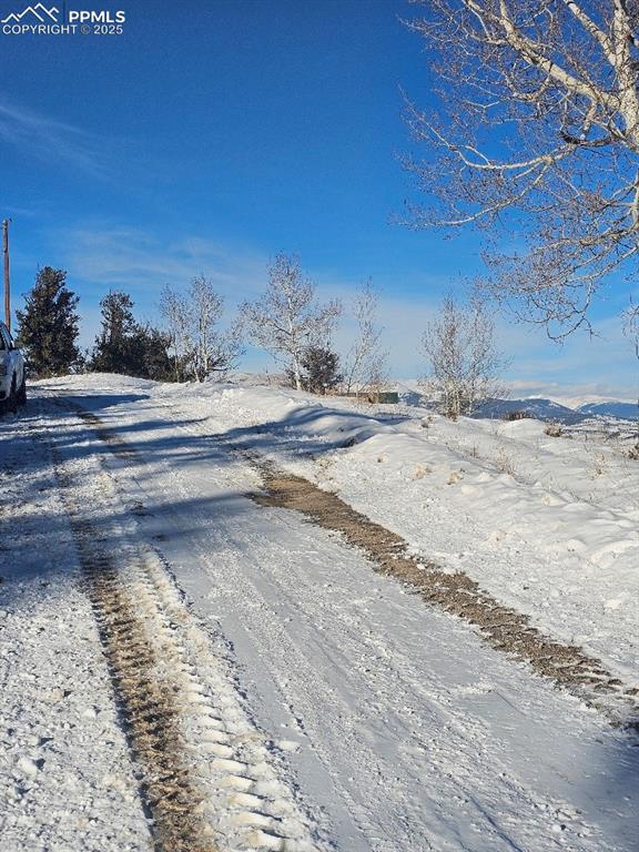 Image 19 of 20: Heading west on Middle Fork, in front of property, the entire subdivision i