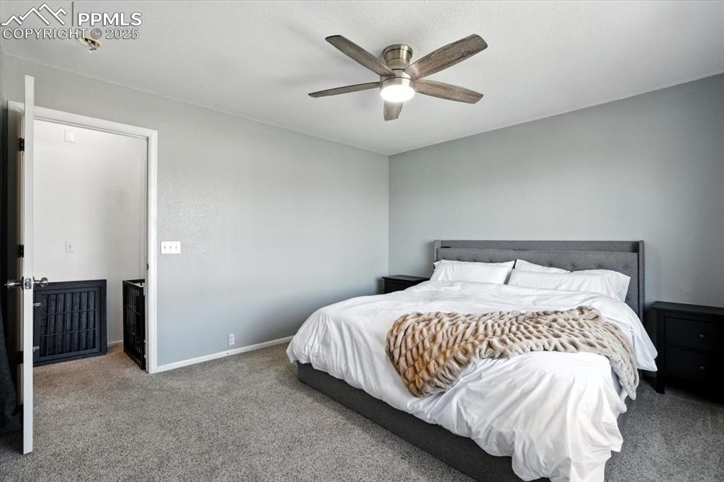 Image 12 of 33: Bedroom featuring carpet flooring and ceiling fan