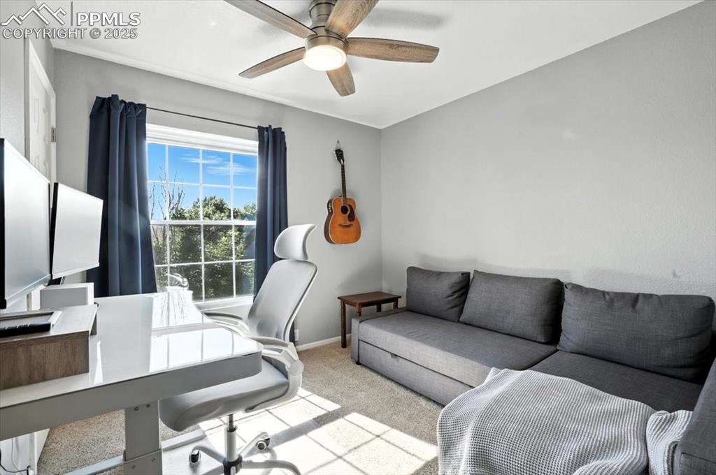 Image 15 of 33: Carpeted office space featuring baseboards