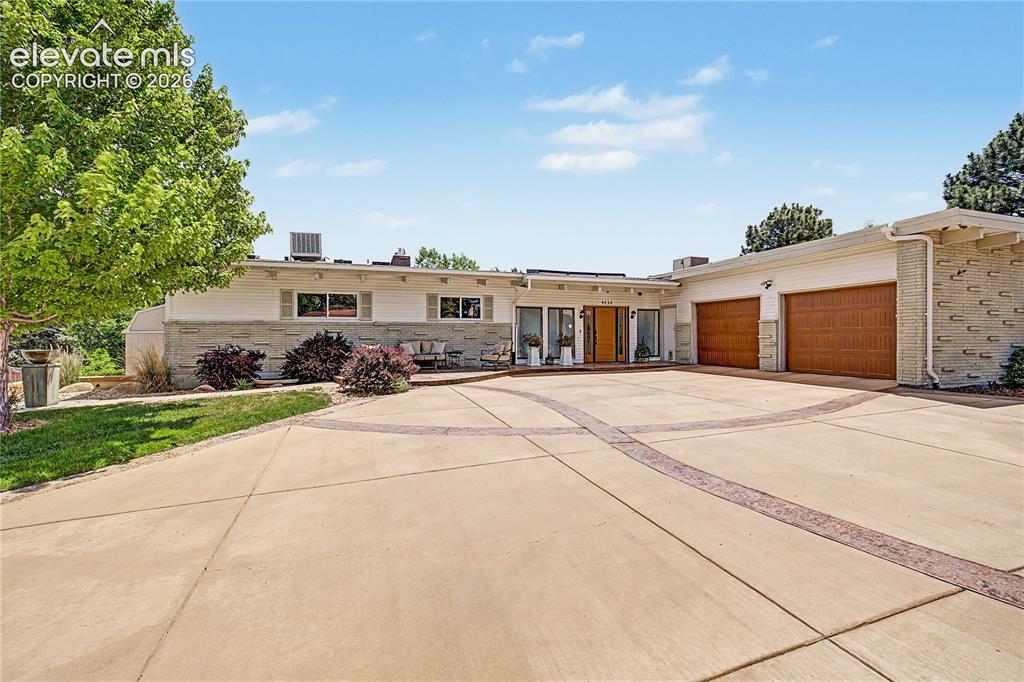 Image 1 of 50: Set back behind mature pines on a quiet stretch of Valli Vista Road, this m