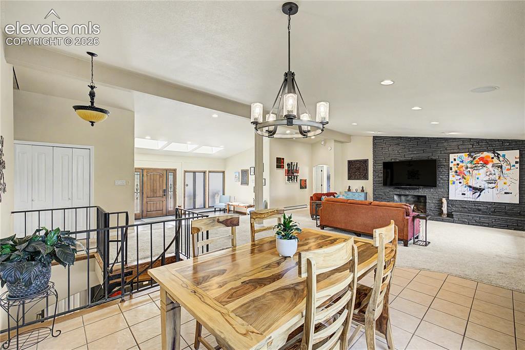 Image 11 of 50: The vaulted ceilings and skylit great room reveal just how much natural lig