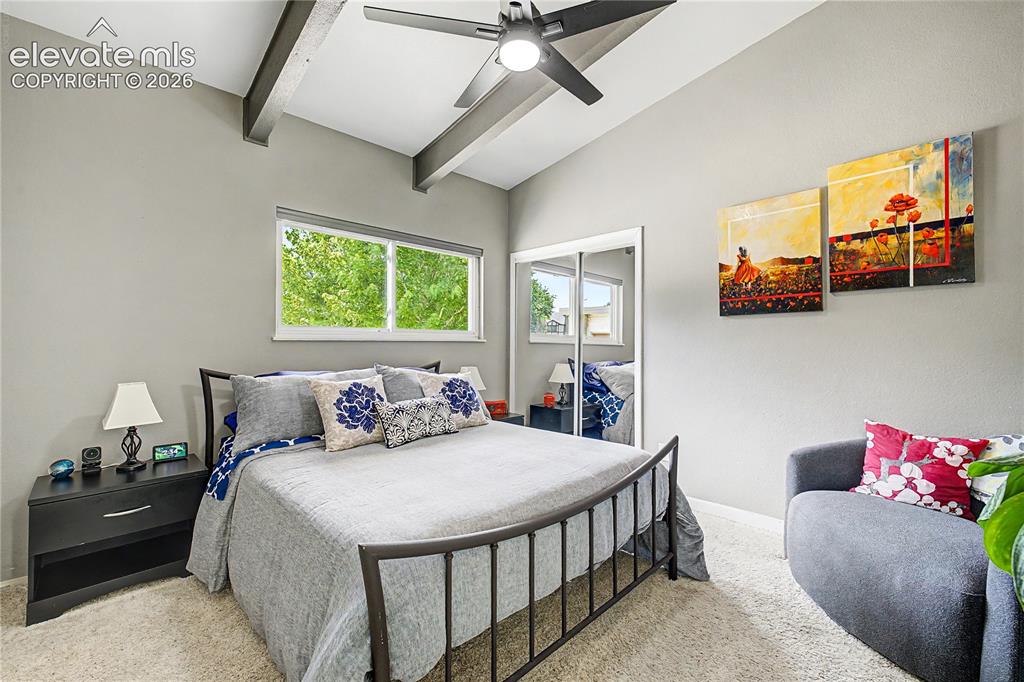 Image 24 of 50: A secondary bedroom carries forward the home