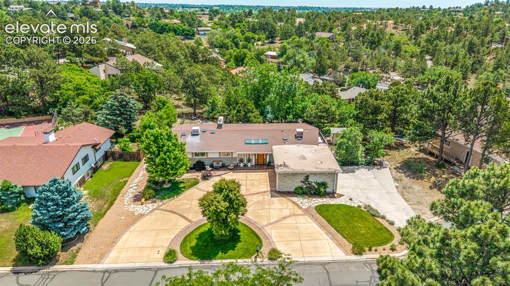 Image 46 of 50: An aerial view reveals the full scope of the property, from the circular mo