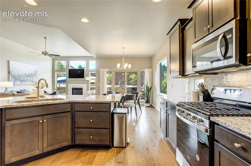 Image 18 of 48: The open layout allows the kitchen to remain connected to both indoor and o