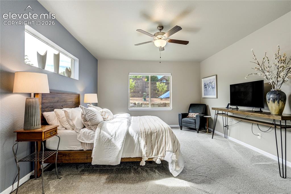 Image 24 of 48: Privately positioned, the spacious primary retreat offers comfort, tranquil
