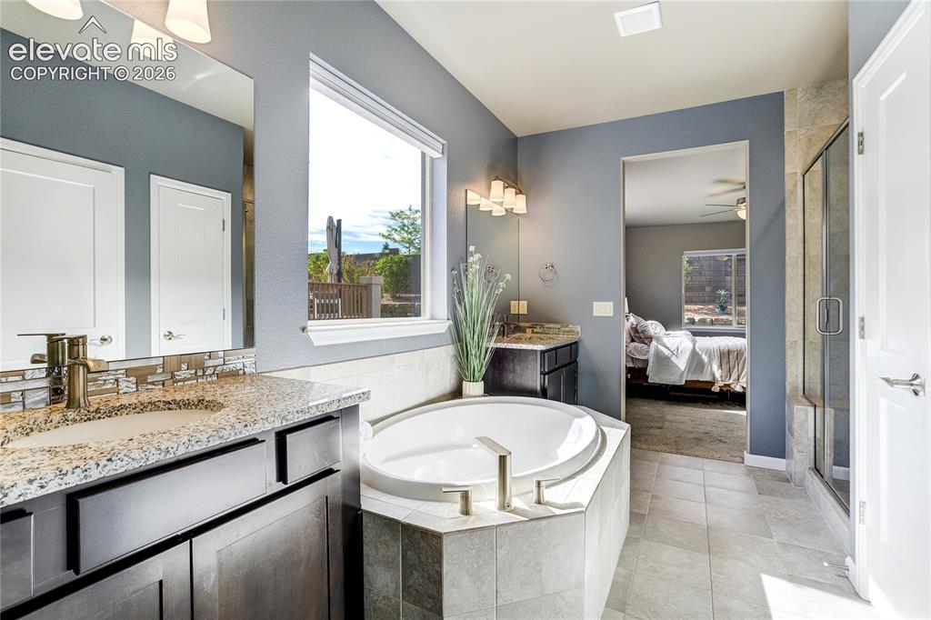 Image 28 of 48: Designed for relaxation, the primary bath creates a true retreat experience